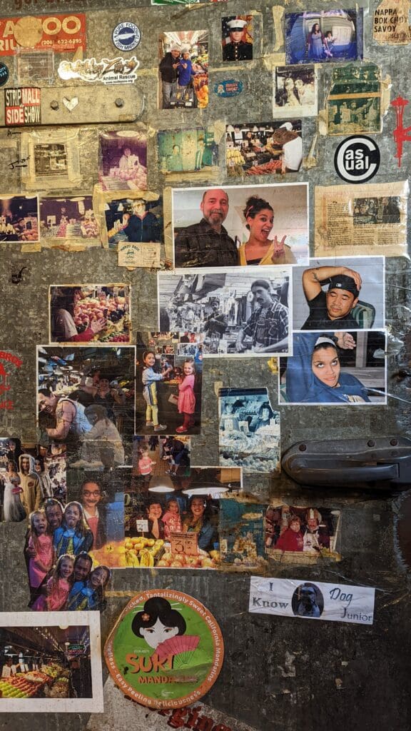 Photos taped to a storage refrigerator at Manzo Brothers Produce